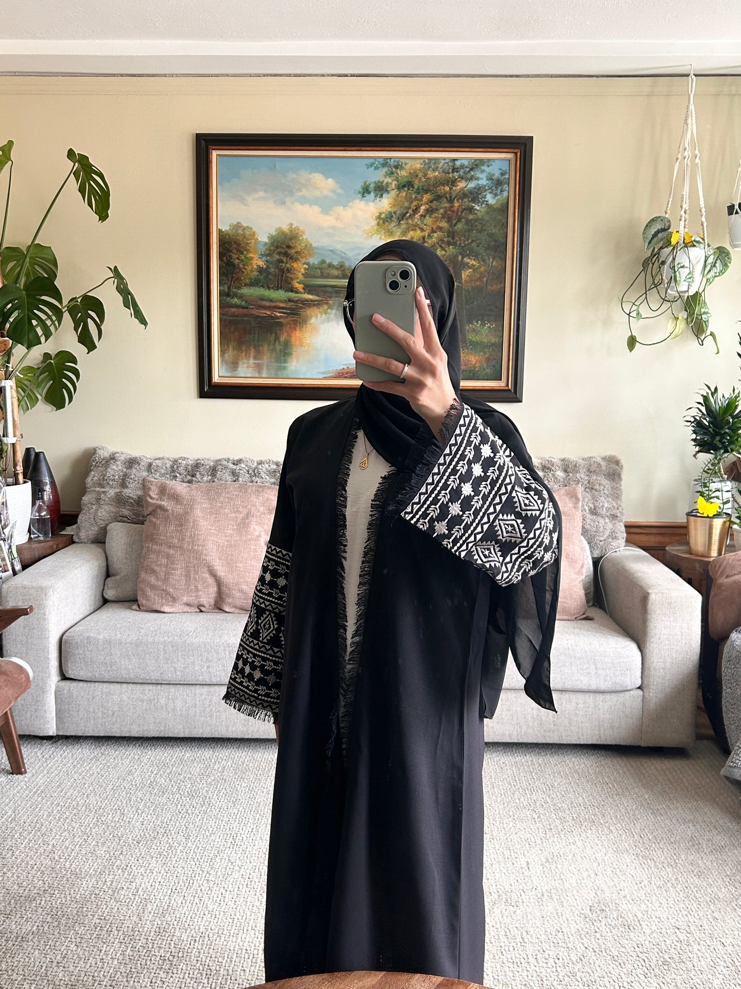 Stylish black embroidered abaya featuring intricate designs for a sophisticated look.