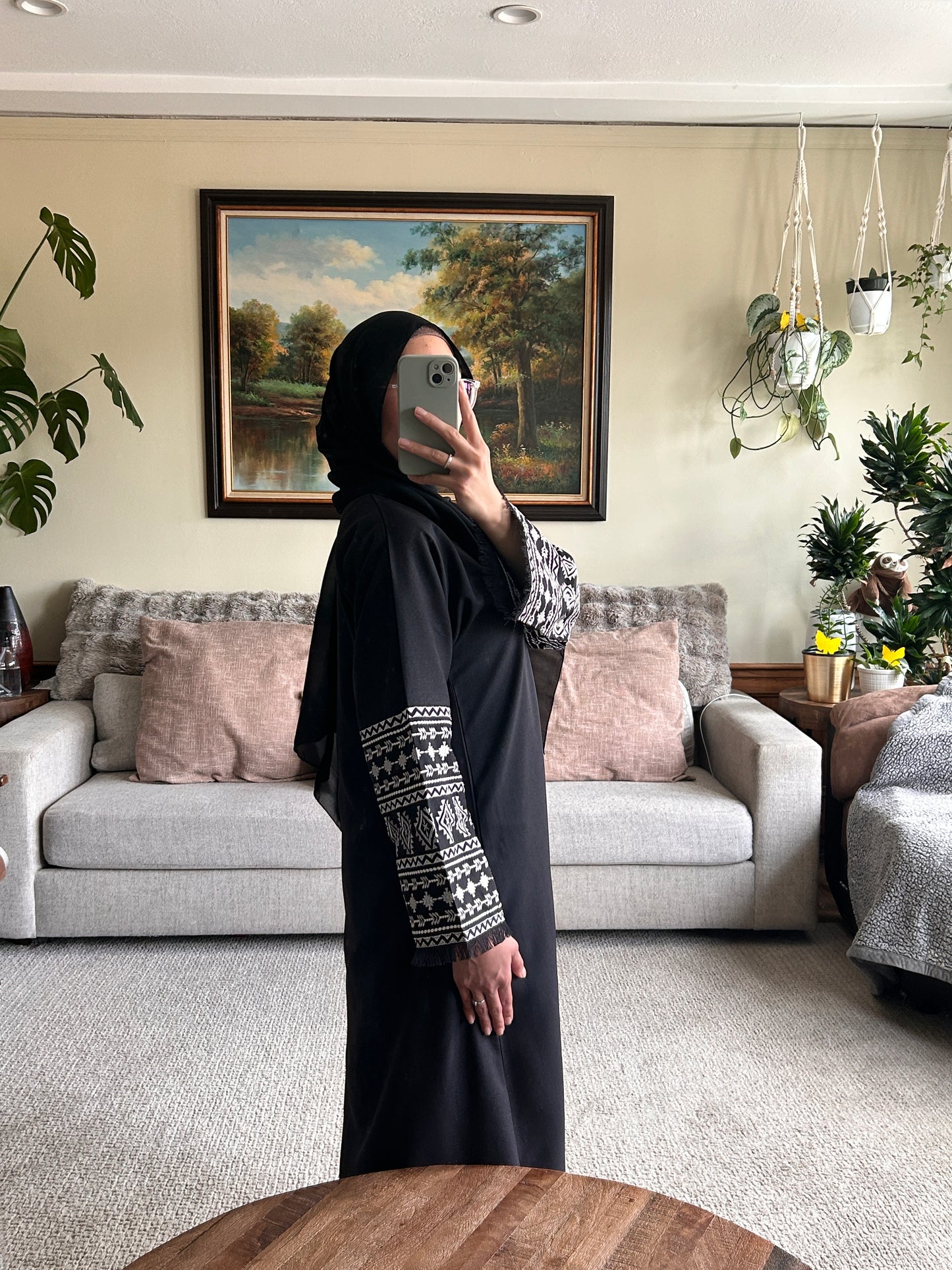 Stylish black embroidered abaya featuring intricate designs for a sophisticated look.